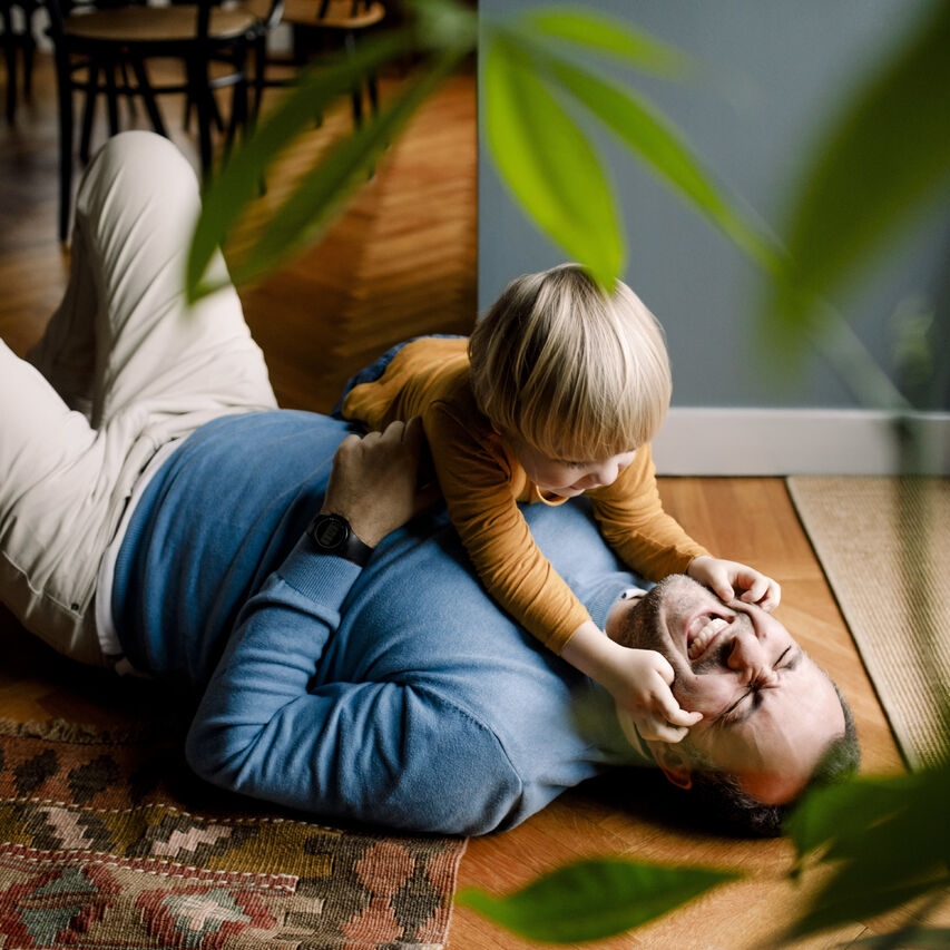 Father and son playing on the floor